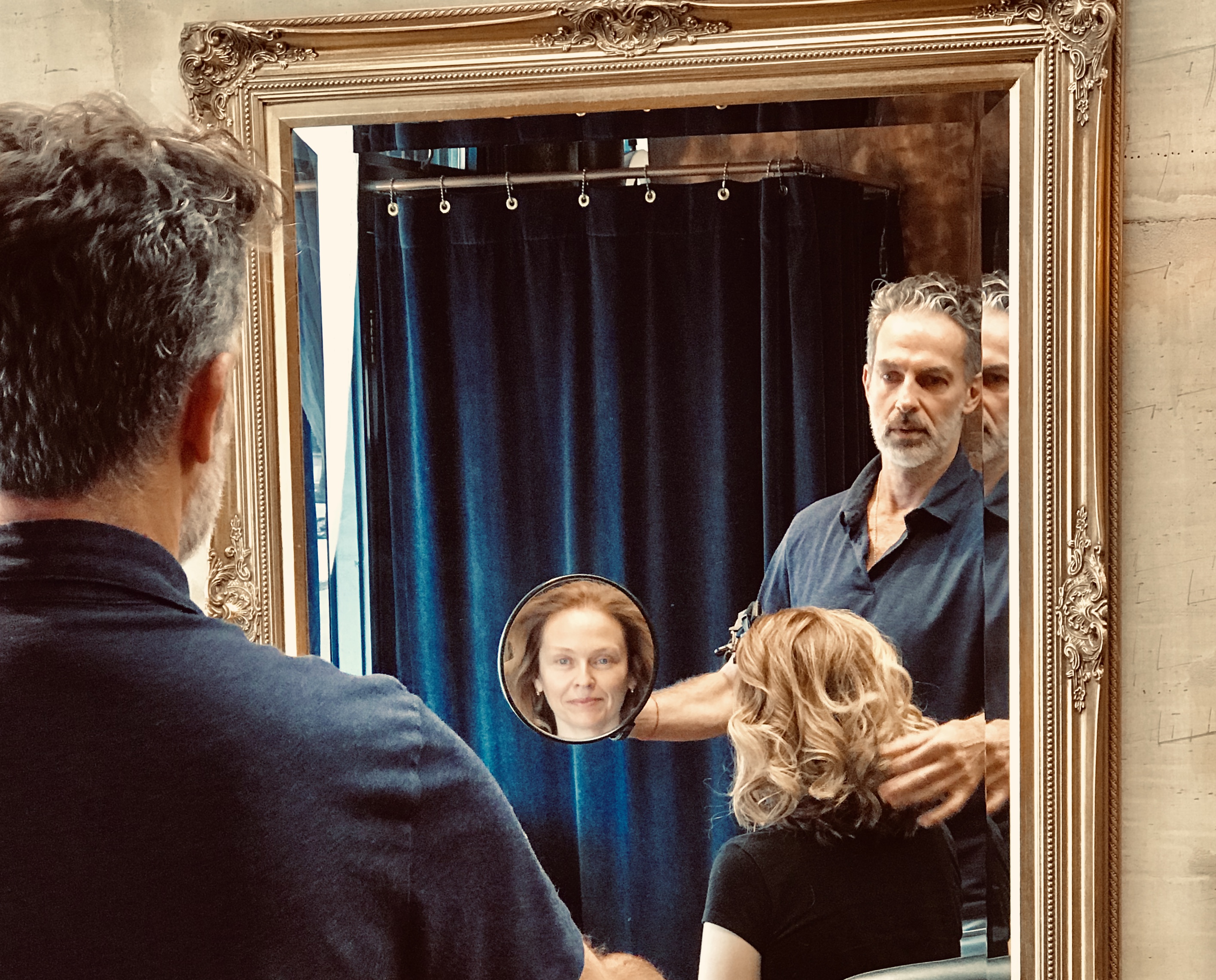 Working at the gilded baroque mirror